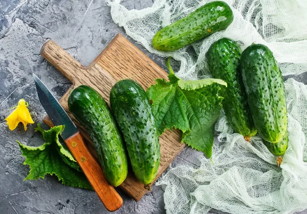 Cucumbers on cutting board — Stock Photo, Image