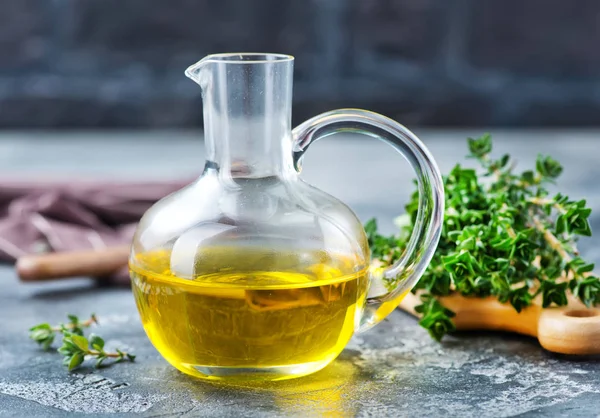 Thyme oil in jug — Stock Photo, Image