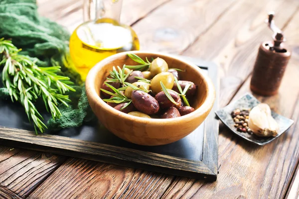 olives in bowl and oil