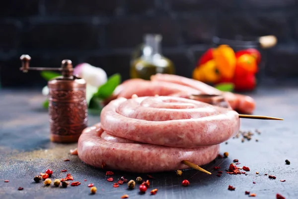 Raw sausages with spice — Stock Photo, Image