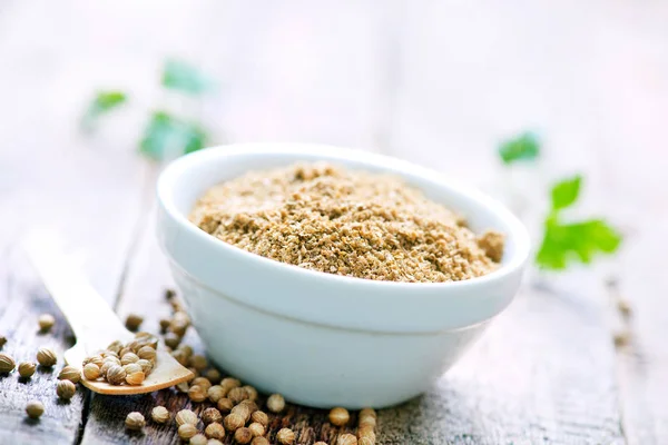 Ground coriander in bowl — Stock Photo, Image