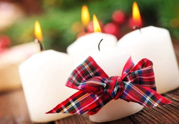 Burning candles with ribbon — Stock Photo, Image