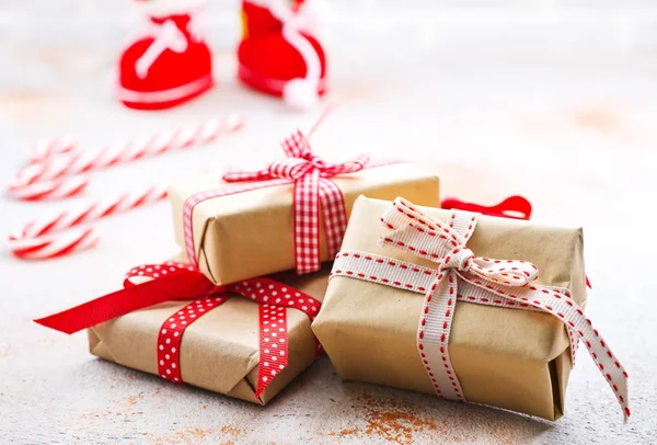 Christmas gift boxes and candy canes — Stock Photo, Image
