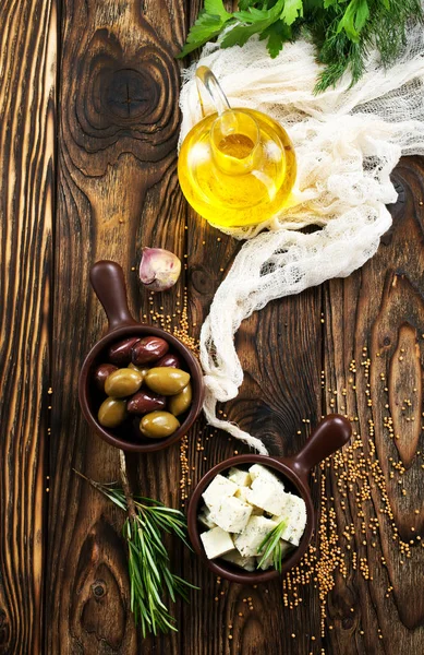 Cheese and olives in bowl — Stock Photo, Image