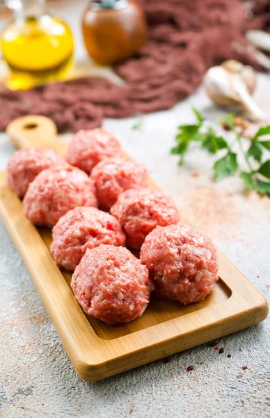 Raw meatballs with aroma spices — Stock Photo, Image