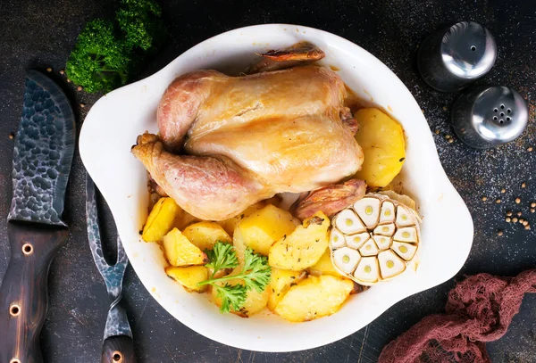 Baked chicken on white plate and on a table — Stock Image Baked Chicken White Plate Table Royalty Free Stock Photos