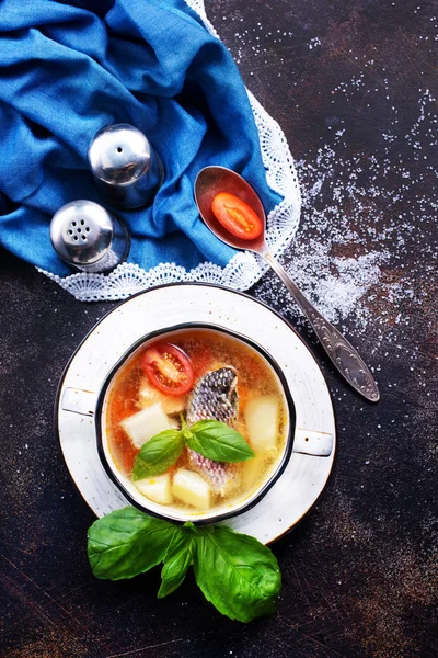 Fish soup in bowl and on a table — Stock Image Fish Soup Bowl Table Royalty Free Stock Images