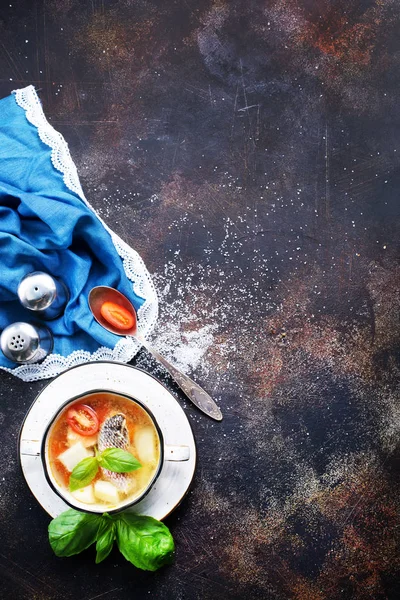 Fish soup in bowl and on a table — Stock Image Fish Soup Bowl Table Stock Image
