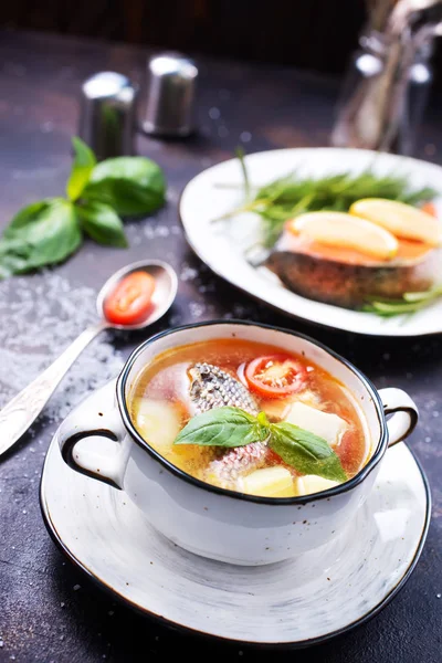 Fish soup in bowl and on a table — Stock Image Fish Soup Bowl Table Stock Image