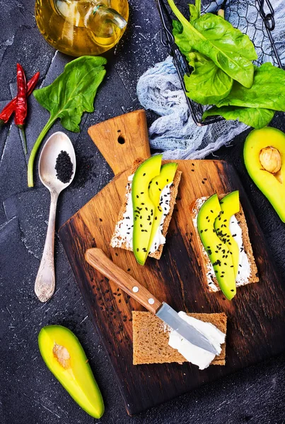 Sandwiches with cheese and avocado — Stock Photo, Image