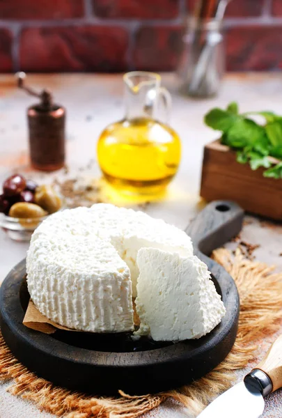 Homemade cheese on wooden board — Stock Photo, Image