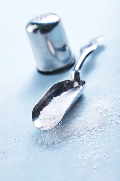Sea salt in metal spoon — Stock Photo, Image