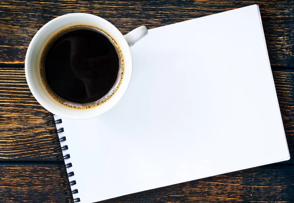 Coffee in cup and paper for note — Stock Photo, Image