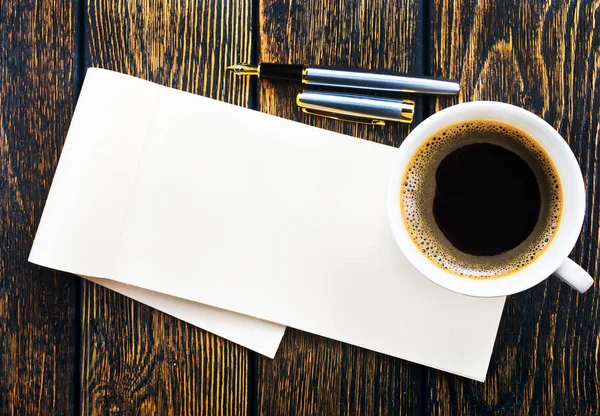 Coffee in cup and paper for note — Stock Photo, Image