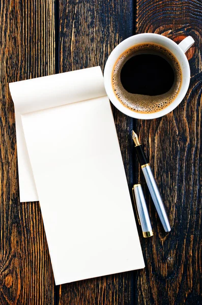 Coffee in cup and paper for note — Stock Photo, Image