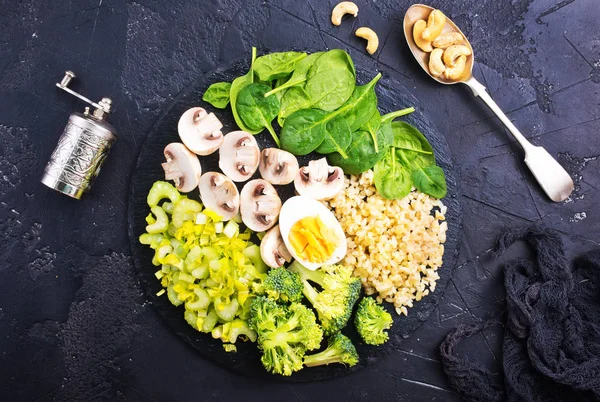 healthy dinner, boiled bulgur with vegetables, mushrooms and egg