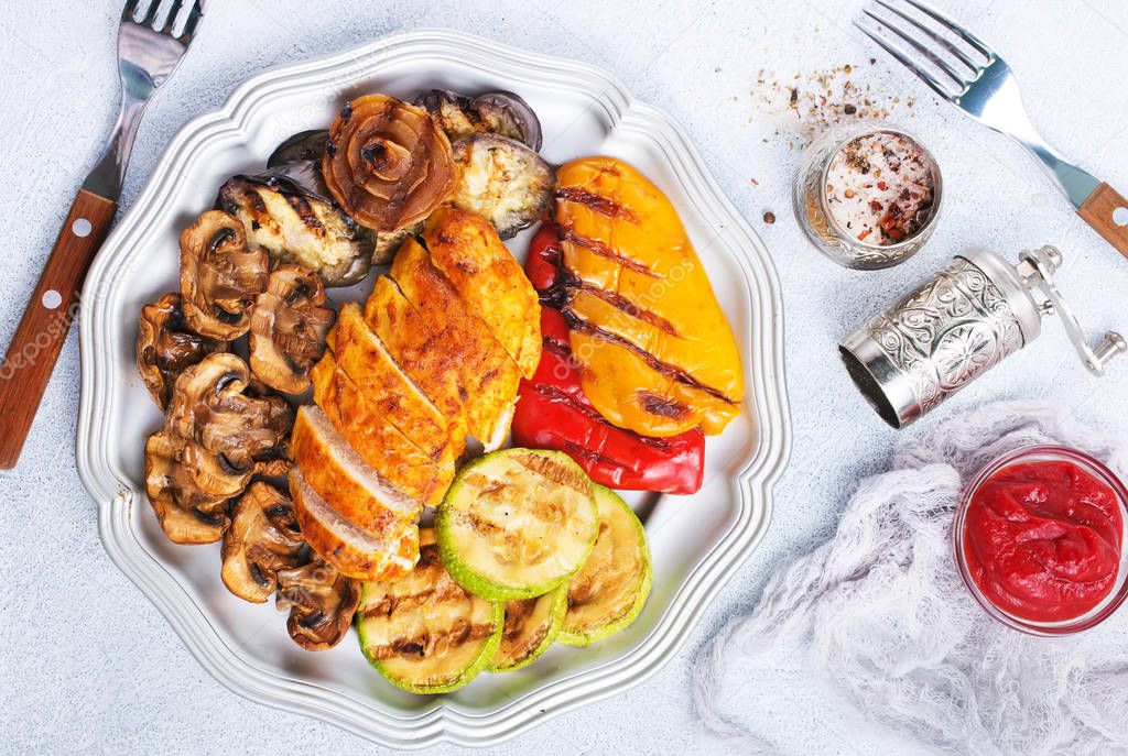 grilled chicken meat and vegetables on plate