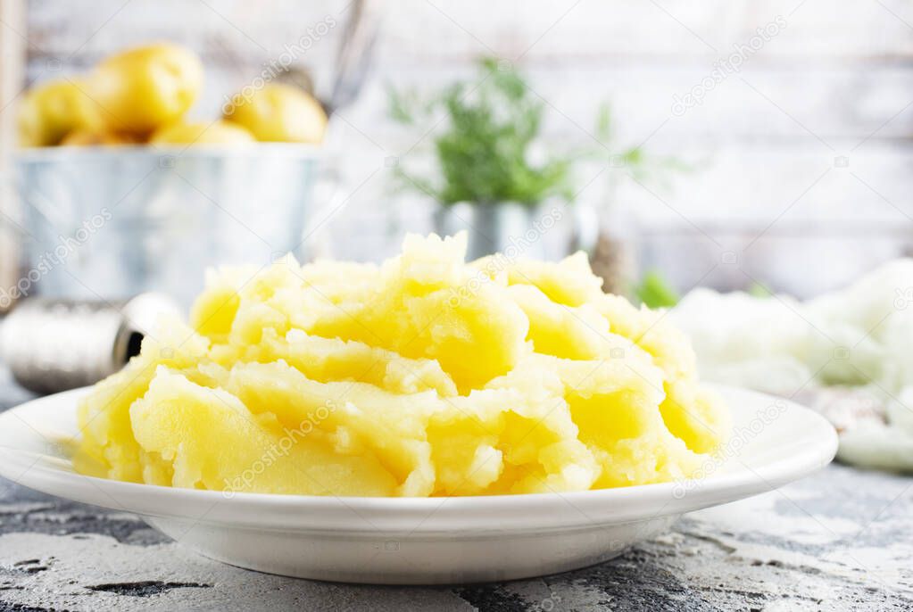mashed potato with butter in white bowl 