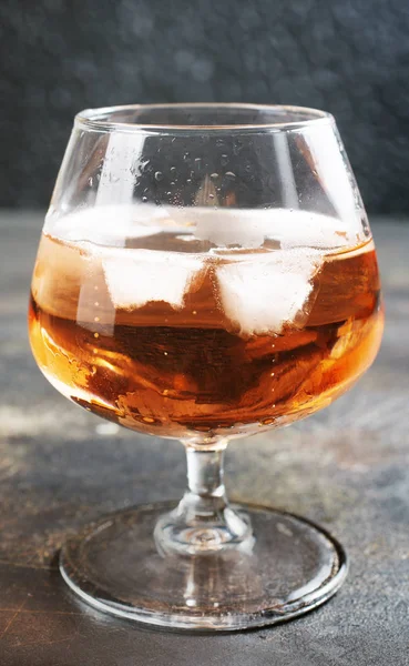 Cognac with ice cubes — 스톡 사진