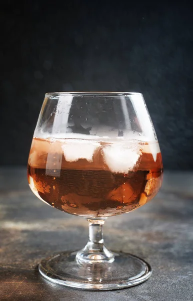 Cognac with ice cubes — 스톡 사진