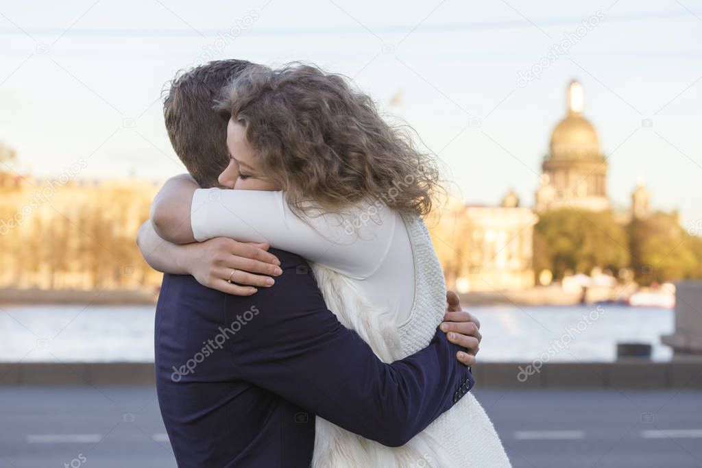 Lovers embrace against the background of St. Isaac's Cathedral i