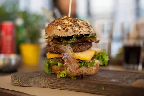 Wonderful juicy double burger with cheese, lettuce and bacon