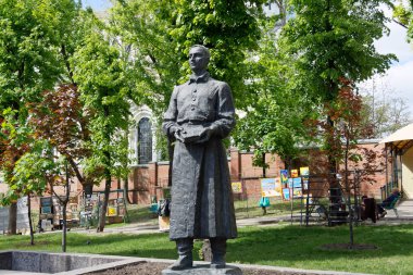Kharkiv, Ukraine - May 3, 2016: The monument to philosopher and poet Hryhorii Skovoroda (1722 - 1794) in the square near the Cathedral of the Dormition in Kharkiv, Ukraine clipart