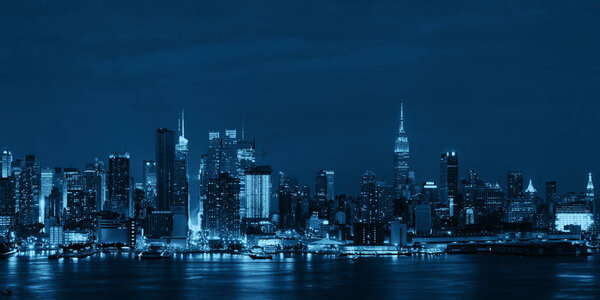 Manhattan midtown skyscrapers and New York City skyline at night panorama