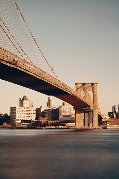 Brooklyn bridge at waterfront in downtown Manhattan New York City.