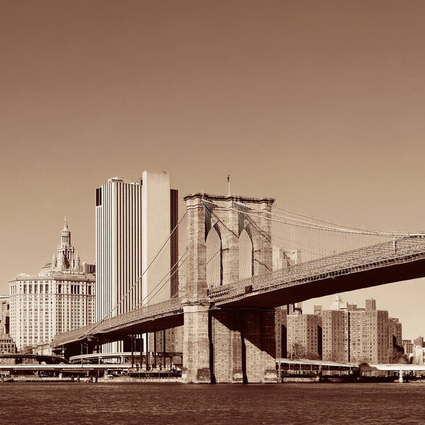 Manhattan financial district with skyscrapers and Brooklyn Bridge.