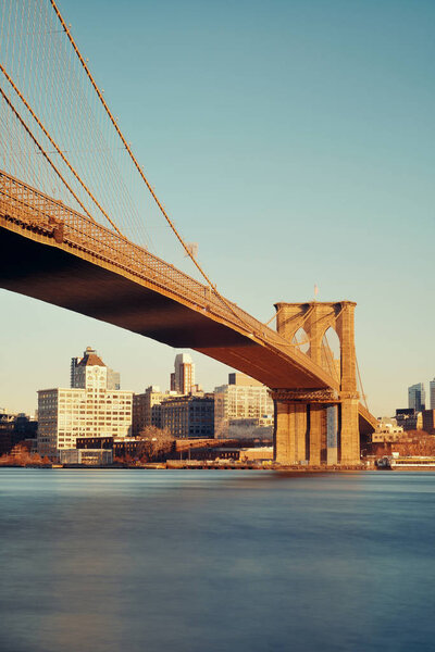 Brooklyn bridge at waterfront in downtown Manhattan, New York City.
