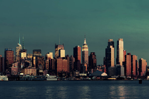 Midtown Manhattan skyline at dusk panorama over Hudson River