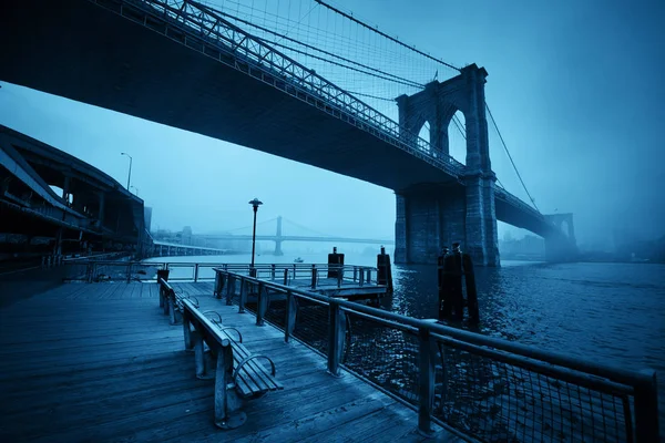Brooklyn Bridge in foggy day 