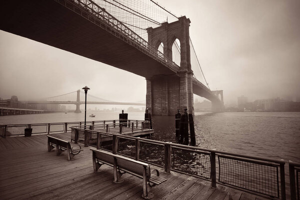 Brooklyn Bridge in a foggy day in downtown Manhattan