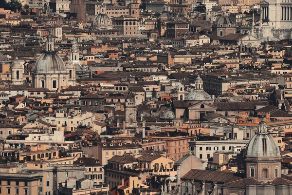 Rome city historical architecture background view from top of St. Peters Basilica in Vatican City.