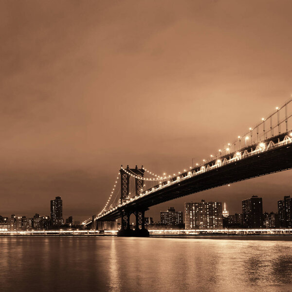 Manhattan Downtown urban view with bridge at night
