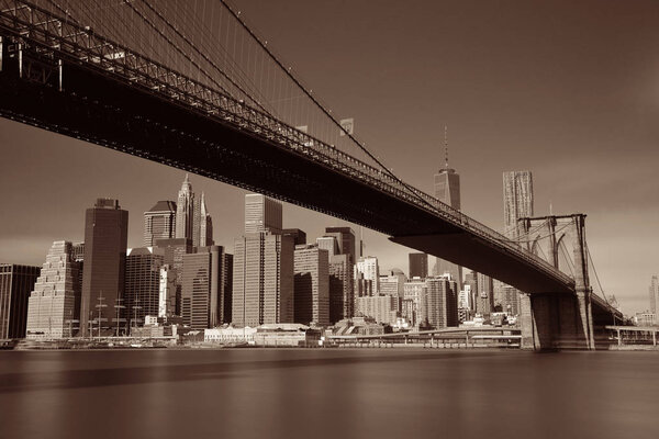 Below Brooklyn Bridge with downtown Manhattan skyline in New York City