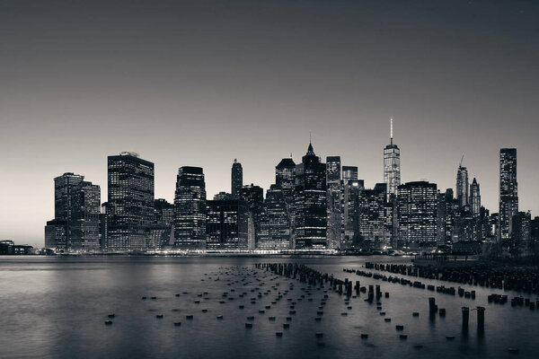 New York City downtown skyline with pier remains at dusk