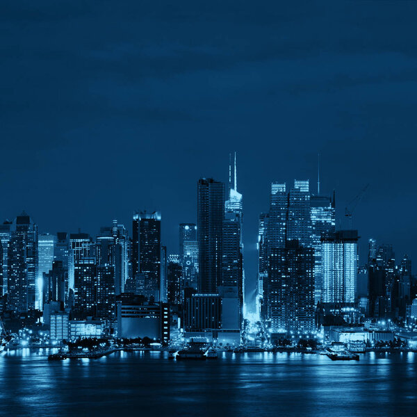 Manhattan midtown skyscrapers and New York City skyline at night