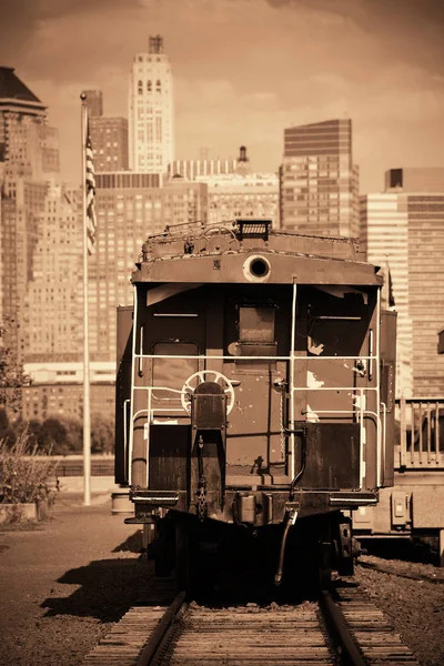 Old train and downtown — Stock Photo, Image
