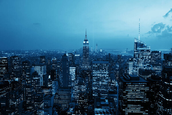 New York City night rooftop view with urban architectures