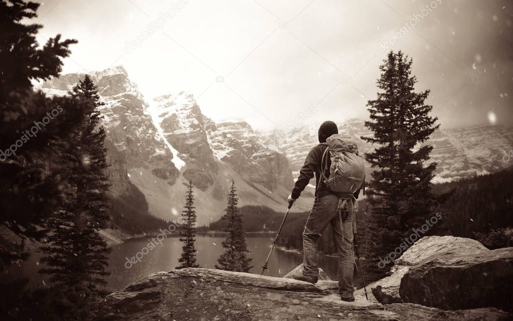 Hiker in wild with snow mountain