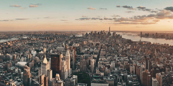 New York City downtown skyline panoramic view at sunset.