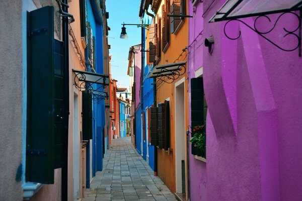 Street view of Burano colorful historical buildings. Venice, Italy.