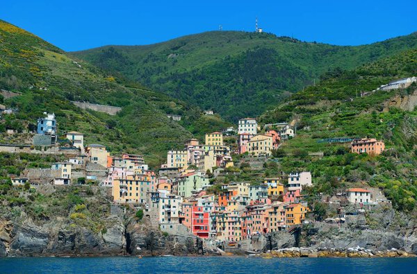 Riomaggiore waterfront view with buildings in Cinque Terre, Italy.