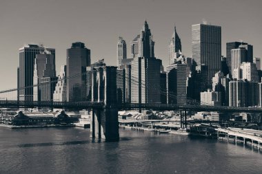 Manhattan financial district with skyscrapers and Brooklyn Bridge. clipart