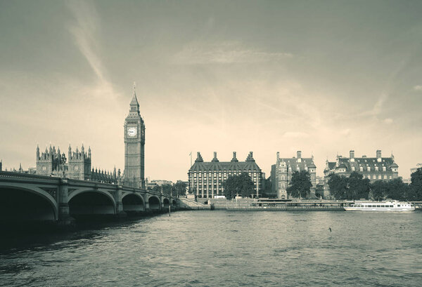 Big Ben and House of Parliament in London panorama over Thames River.