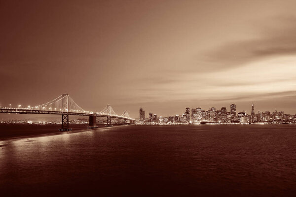 Bay Bridge and San Francisco downtown skyline at dusk