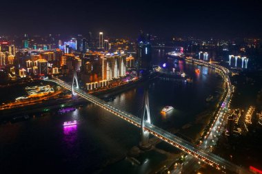 Aerial view of Bridge and city urban architecture at night in Chongqing, China. clipart