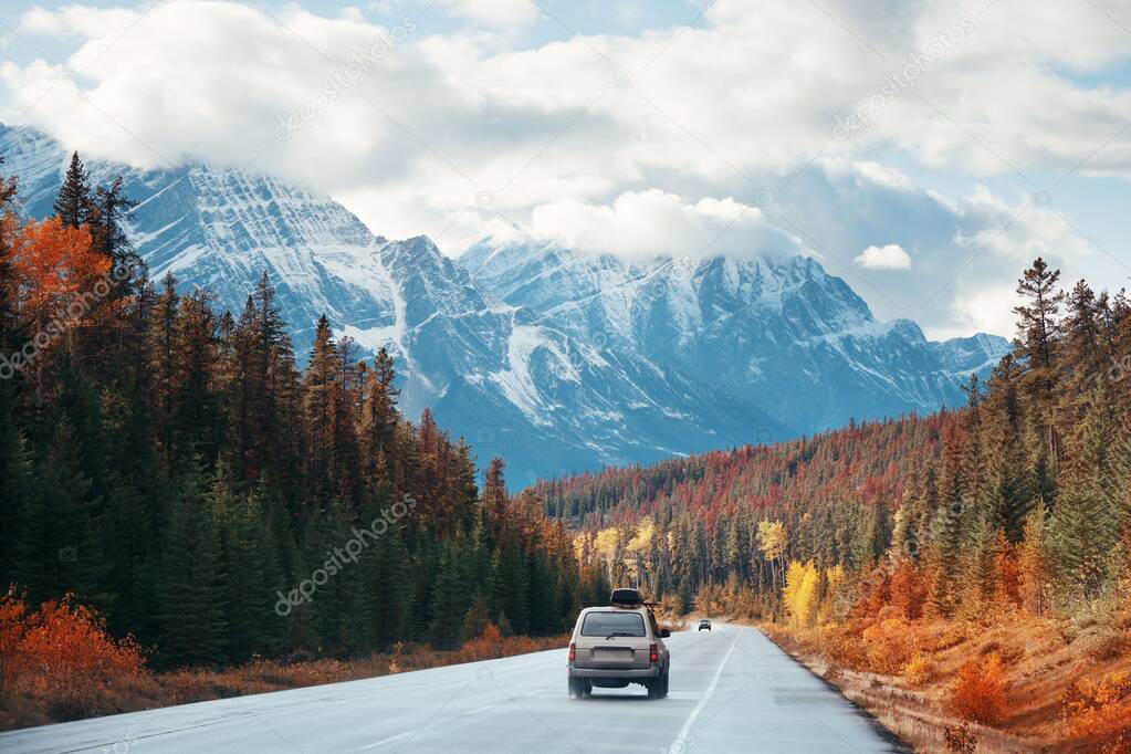 Car on road in Banff National Park in Canada